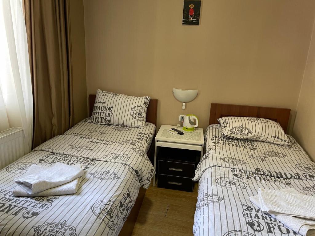 Postel nebo postele na pokoji v ubytování Hotel Maria