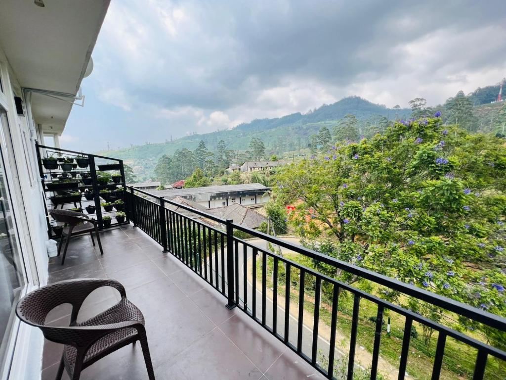 a balcony with a view of a mountain at Dream Stay Green in Nuwara Eliya