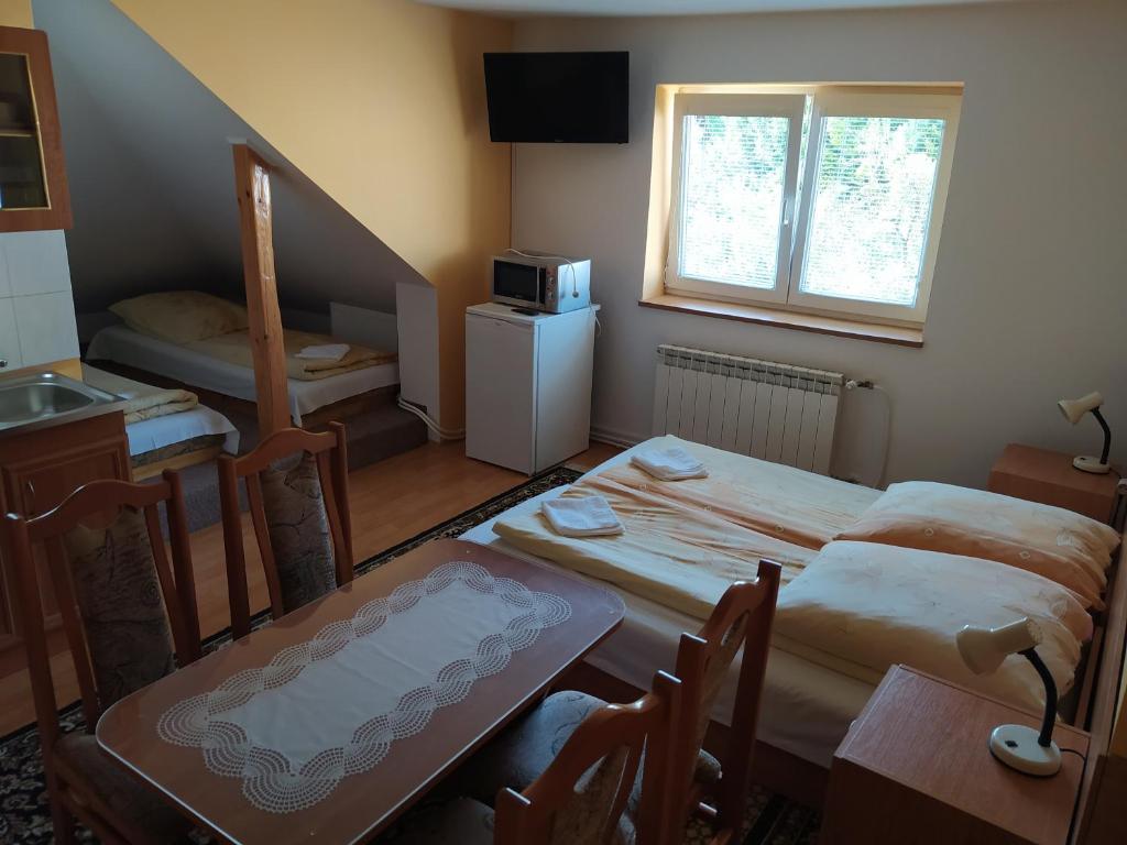 Postel nebo postele na pokoji v ubytování Chalupa pod lipami