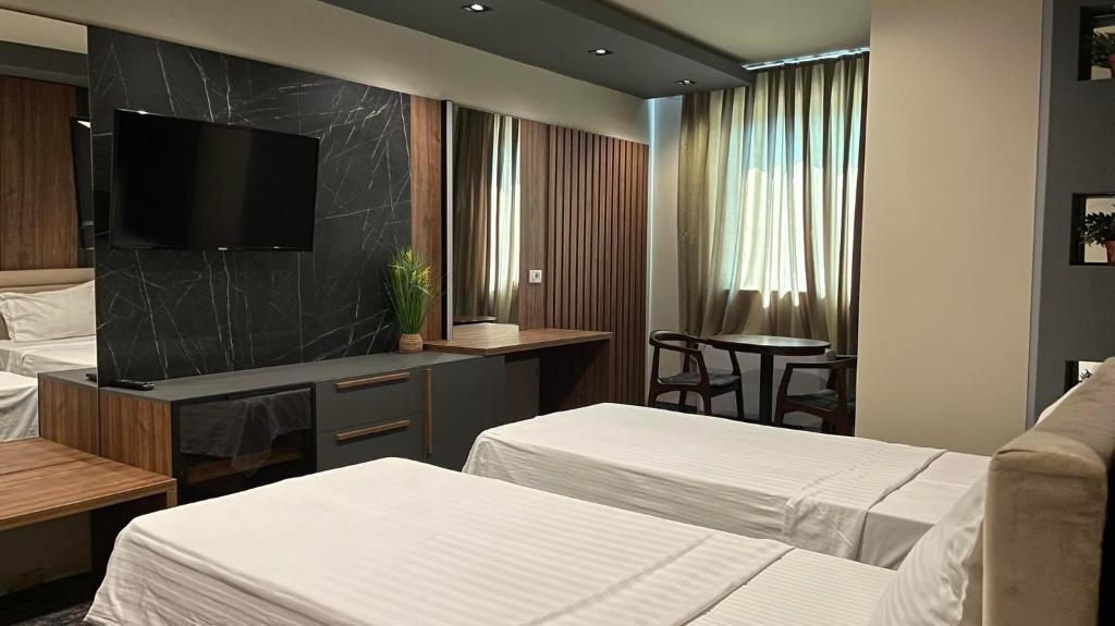 Postel nebo postele na pokoji v ubytování Hotel Emka