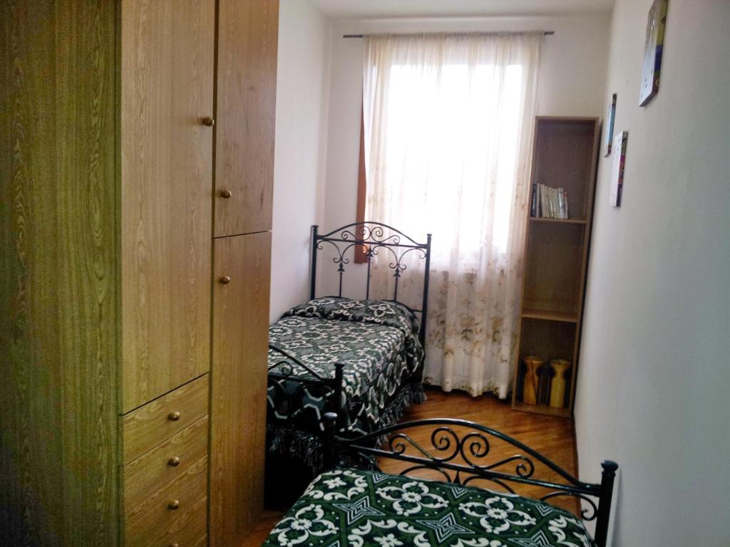 A bed or beds in a room at Assisi Casa degli Angeli
