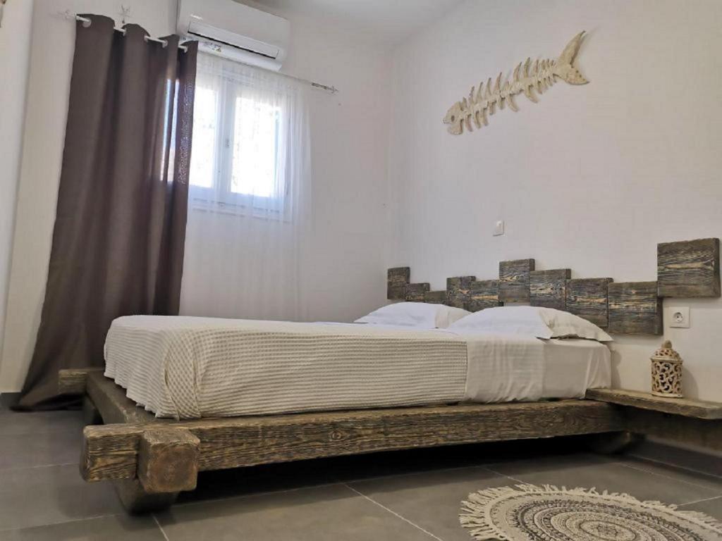 Postel nebo postele na pokoji v ubytování Family Villages Santorini