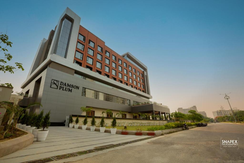 a building with a sign on the front of it at DAMSON PLUM in Lucknow