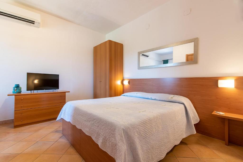 Een bed of bedden in een kamer bij Bonsai B&B Alghero