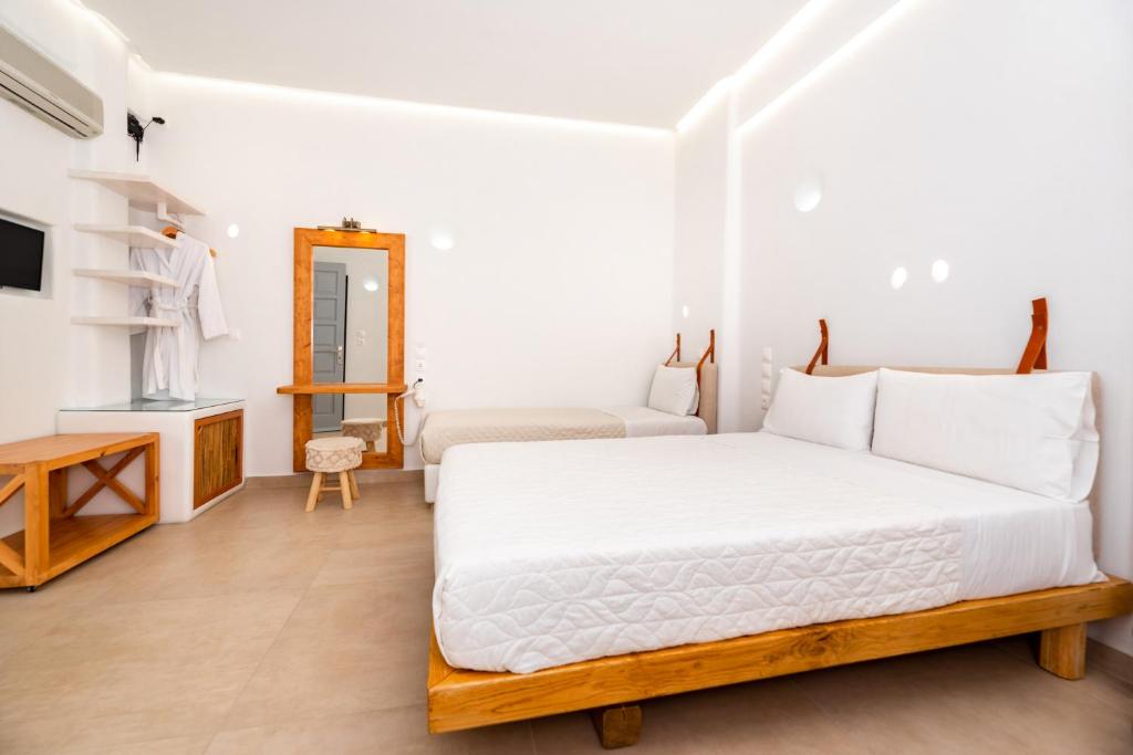 Voodi või voodid majutusasutuse Hotel Thira toas