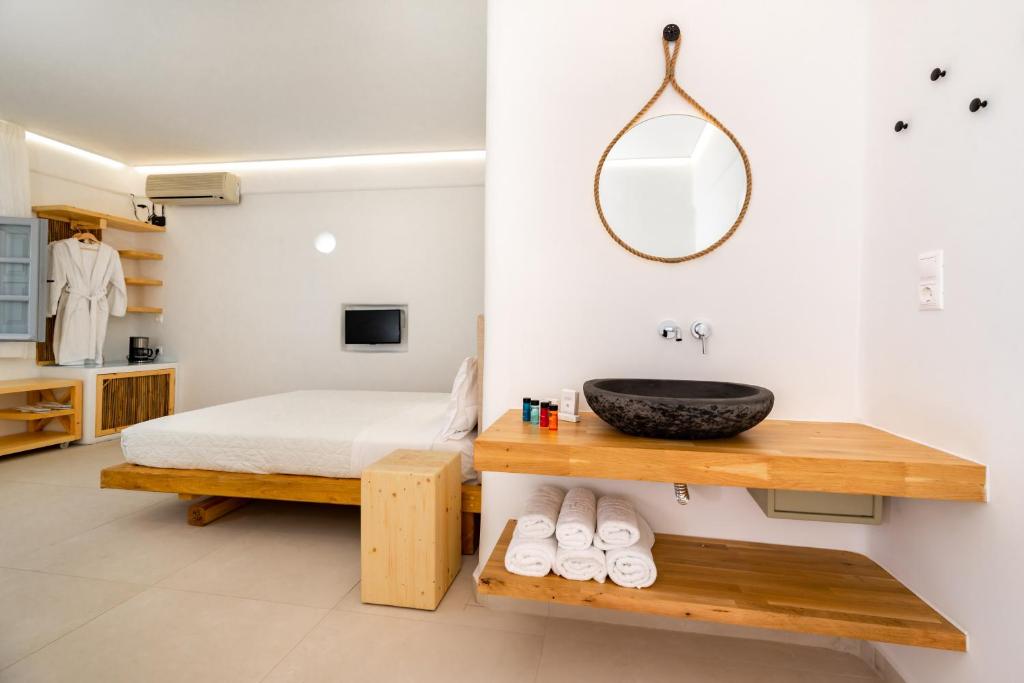 Voodi või voodid majutusasutuse Hotel Thira toas