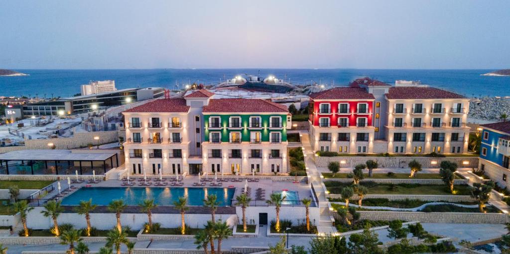 an aerial view of a resort with a pool at Soliport Hotel & SPA in Alaçatı