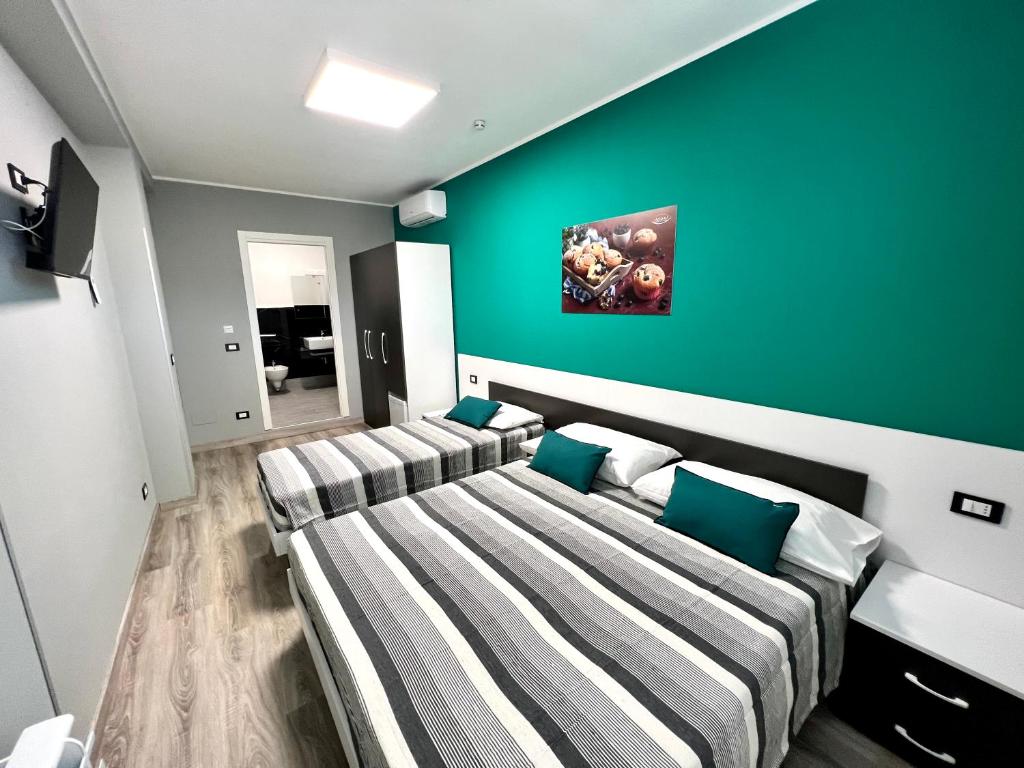 TV a/nebo společenská místnost v ubytování Siclari B&B-Rooms&Suite