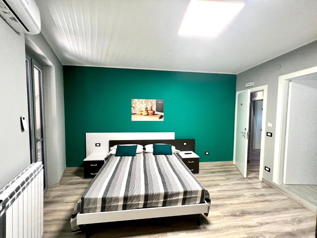 Postel nebo postele na pokoji v ubytování Siclari B&B-Rooms&Suite