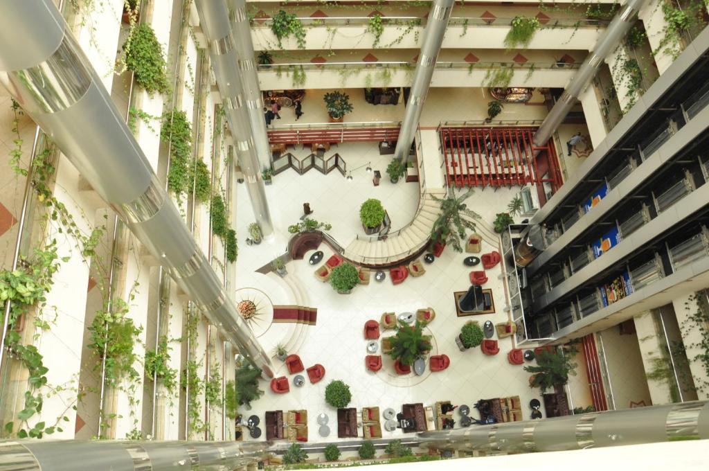 arium of a building with plants on the wall at Inter Luxury Hotel in Addis Ababa