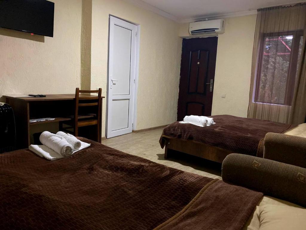 Postel nebo postele na pokoji v ubytování Hotel Villa Eniseli
