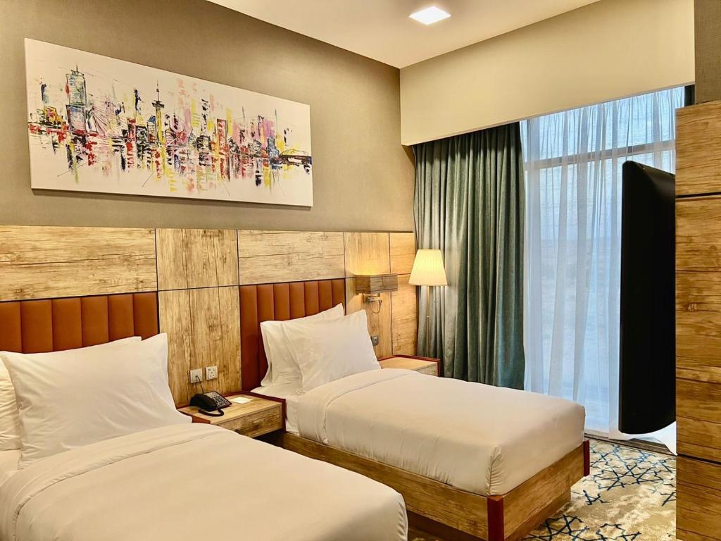 Postel nebo postele na pokoji v ubytování Waves Hotel