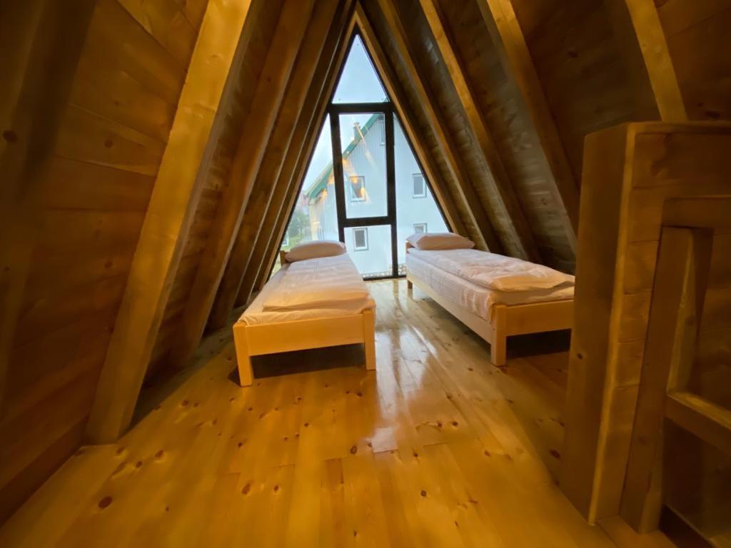 Postel nebo postele na pokoji v ubytování DANDELION HOUSE