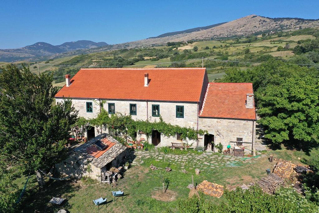 a large white house with an orange roof at chevalier claudio in Agnone