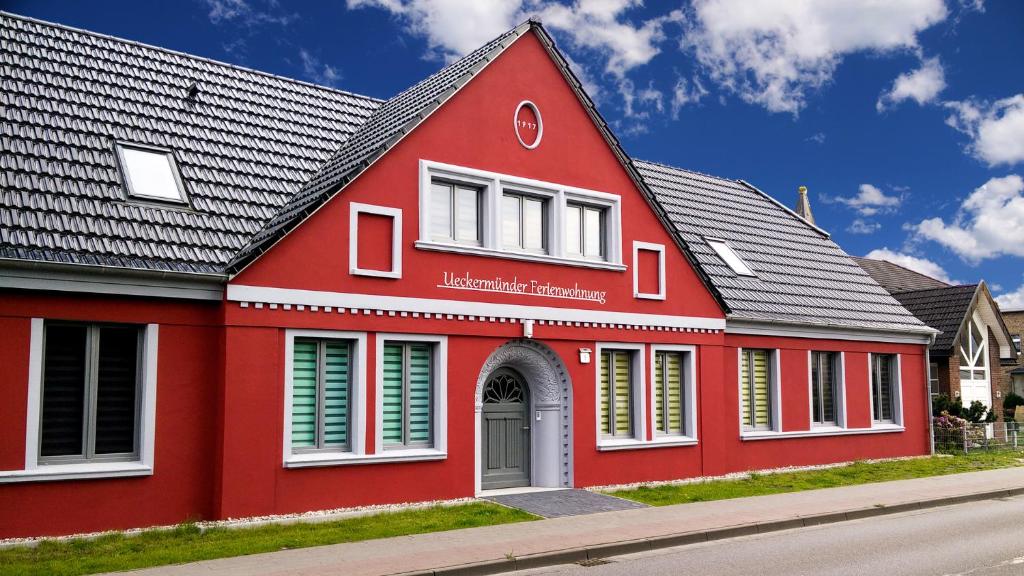 a red building with a black roof at ehem. Gesundheitsamt in Ueckermünde