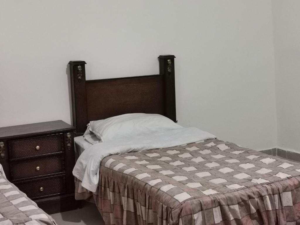 Postel nebo postele na pokoji v ubytování Petra Gate Hotel