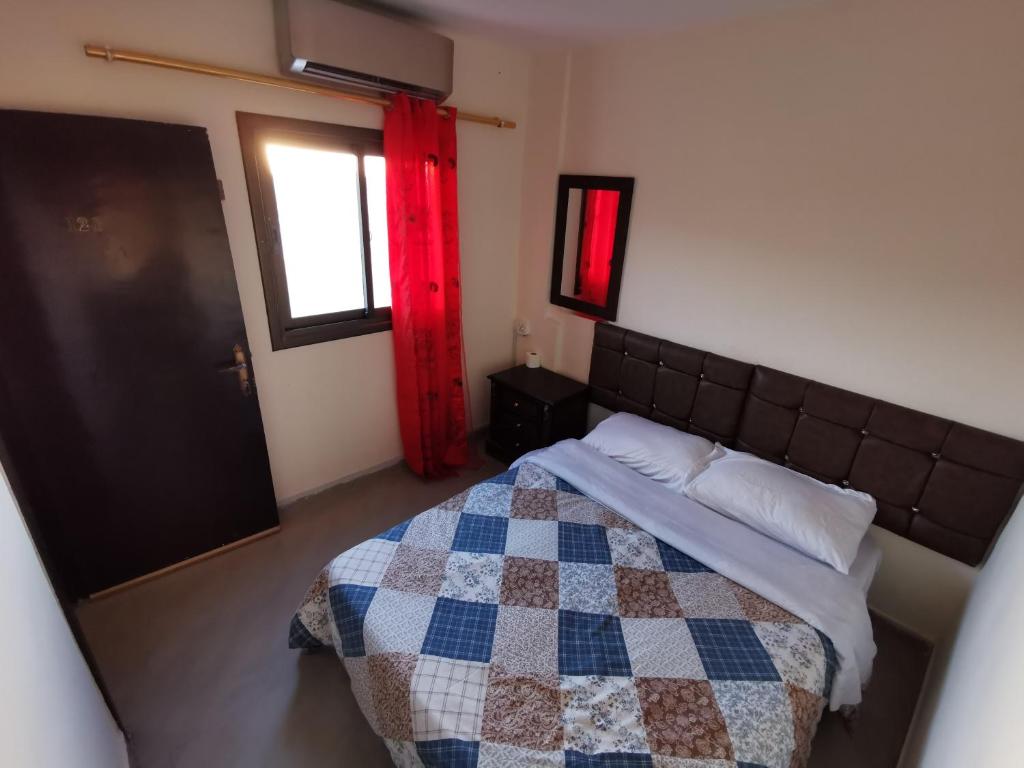 Postel nebo postele na pokoji v ubytování Petra Gate Hotel