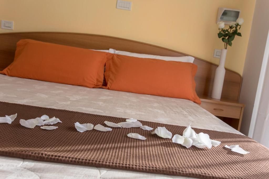 Postel nebo postele na pokoji v ubytování Hotel Emilia