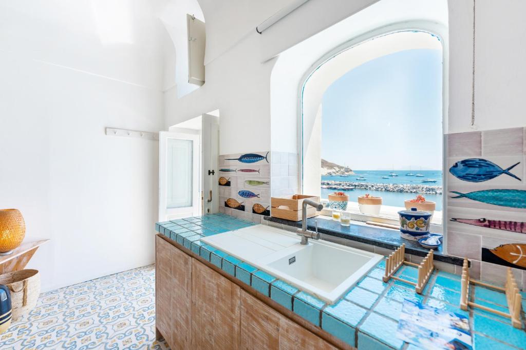 a bathroom with a sink and a window at Casa Gastronomo in Procida
