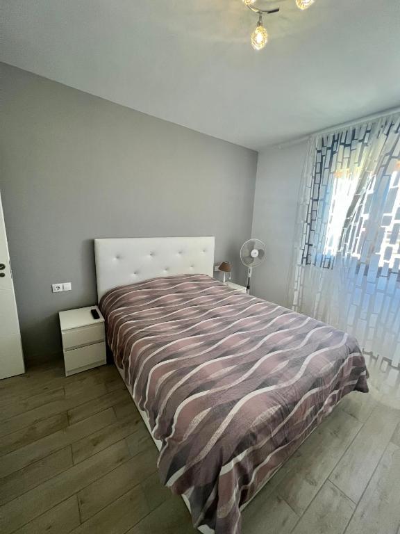 Postel nebo postele na pokoji v ubytování Los Cristianos ||