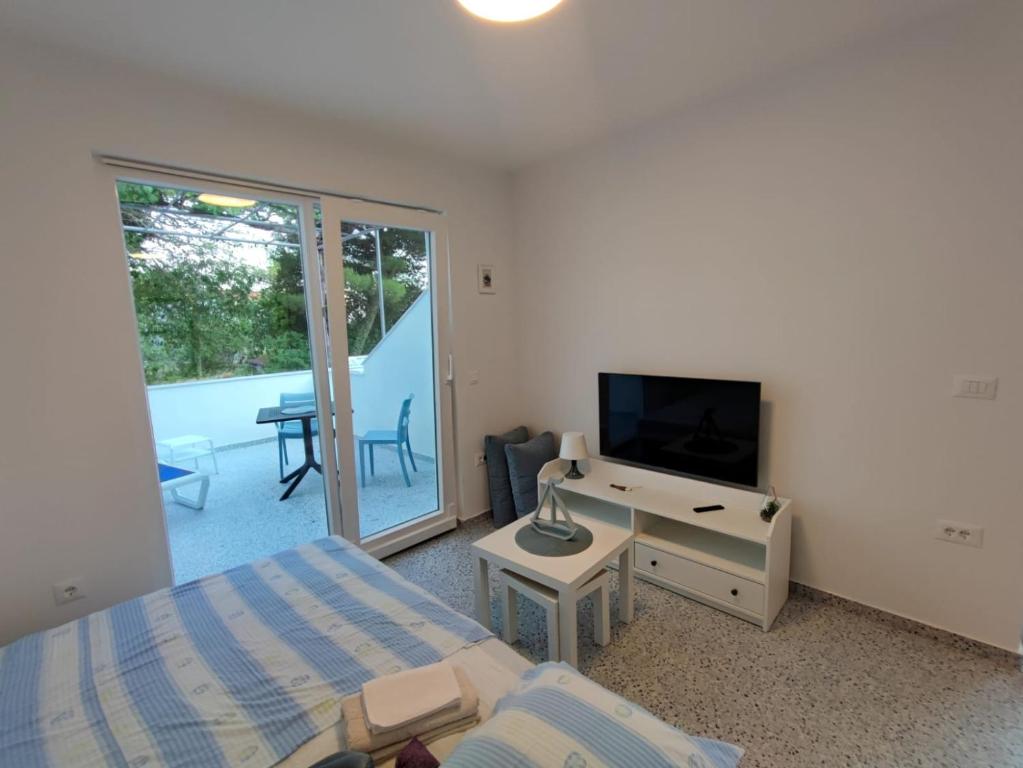 TV a/nebo společenská místnost v ubytování GaLa Apartments Zaostrog
