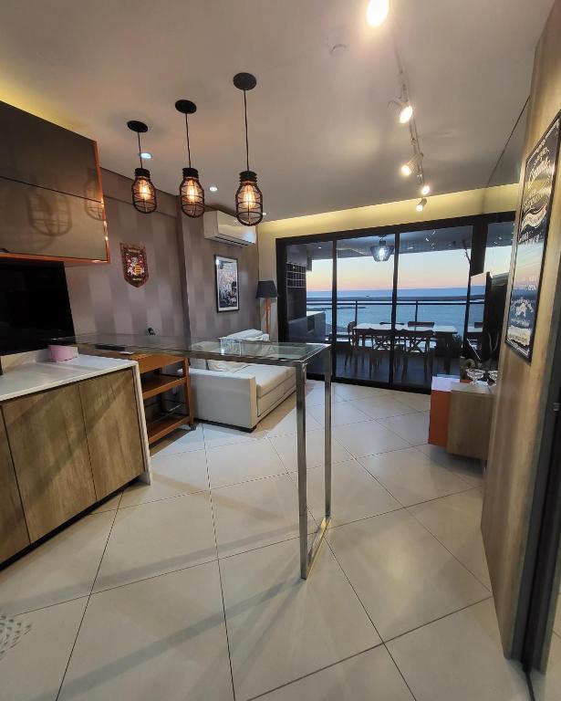 a living room with a view of the ocean at Beira Mar Fortaleza Landscape in Fortaleza