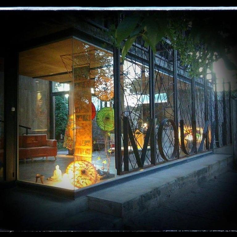 a window of a building with a fire hydrant in it at Mousai Hotel Boutique in Capilla del Monte