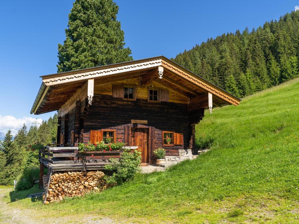 a log cabin on the side of a hill at EAGGA-Niederleger Alm in Alpbach