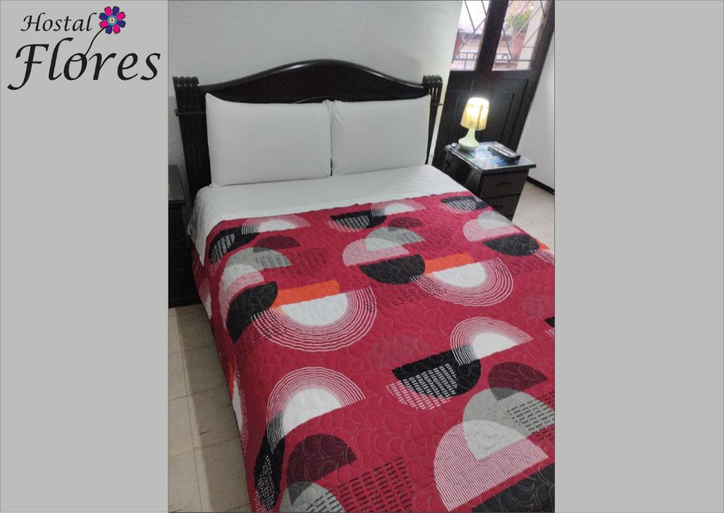 Postel nebo postele na pokoji v ubytování Hostal Flores