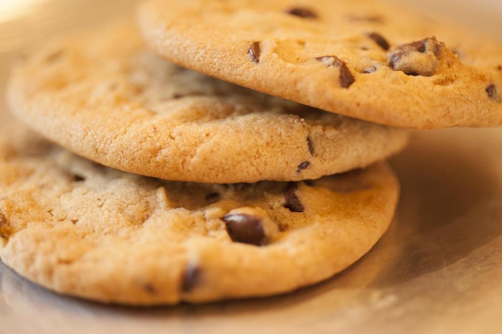 a stack of chocolate chip cookies on a table at The Franciscan Hotel in Santa Barbara