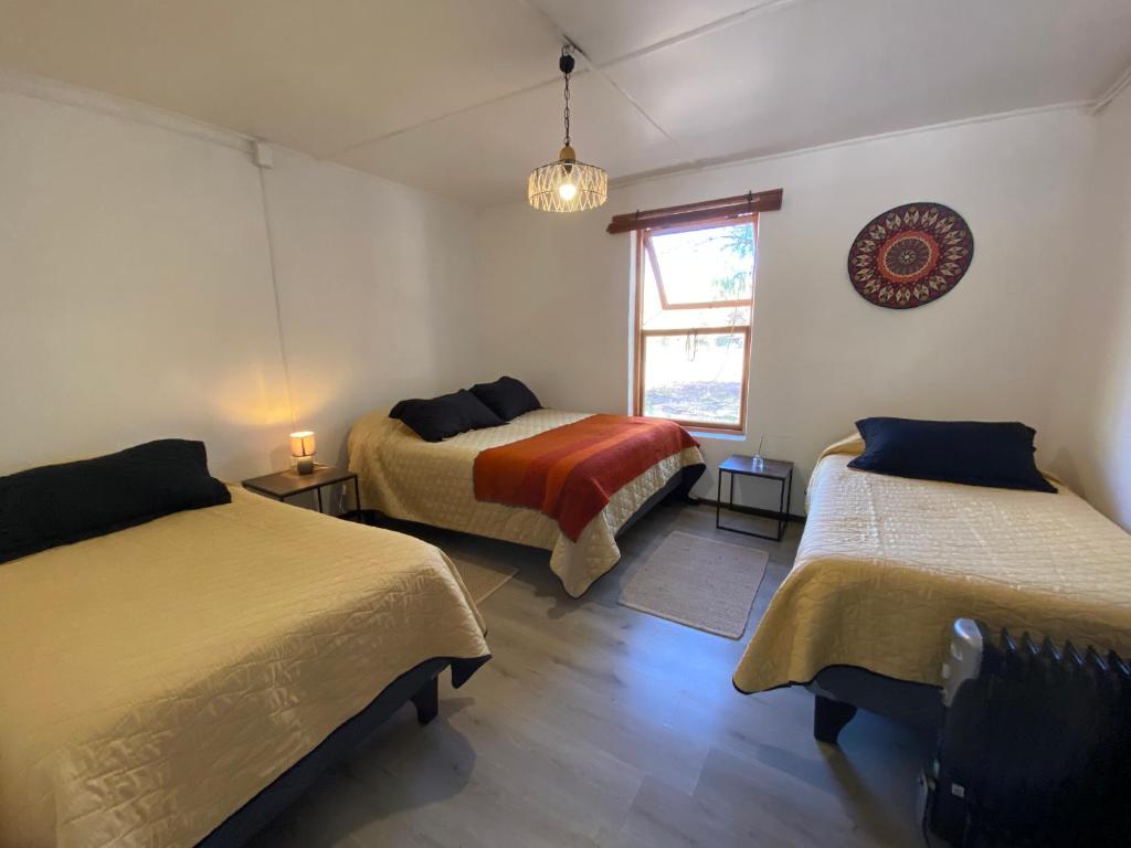 Postel nebo postele na pokoji v ubytování CaminAndes Hostal