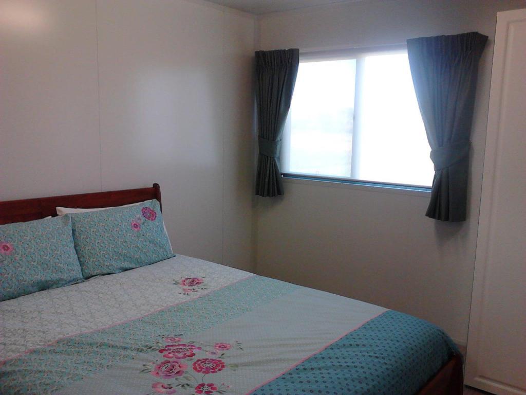 Ένα ή περισσότερα κρεβάτια σε δωμάτιο στο Cabarita Lodge