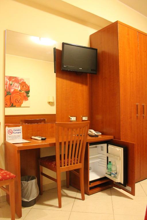 TV a/nebo společenská místnost v ubytování Hotel Vitti