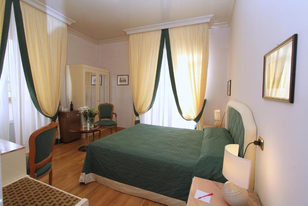 Postel nebo postele na pokoji v ubytování Hotel Cicolella