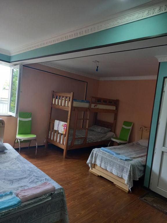 Postel nebo postele na pokoji v ubytování Guest Houze Nona
