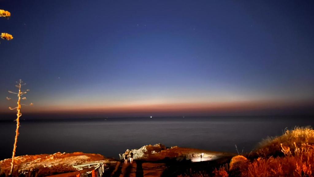 a view of the ocean at night at Sagra Vacanze Cinisi in Cinisi