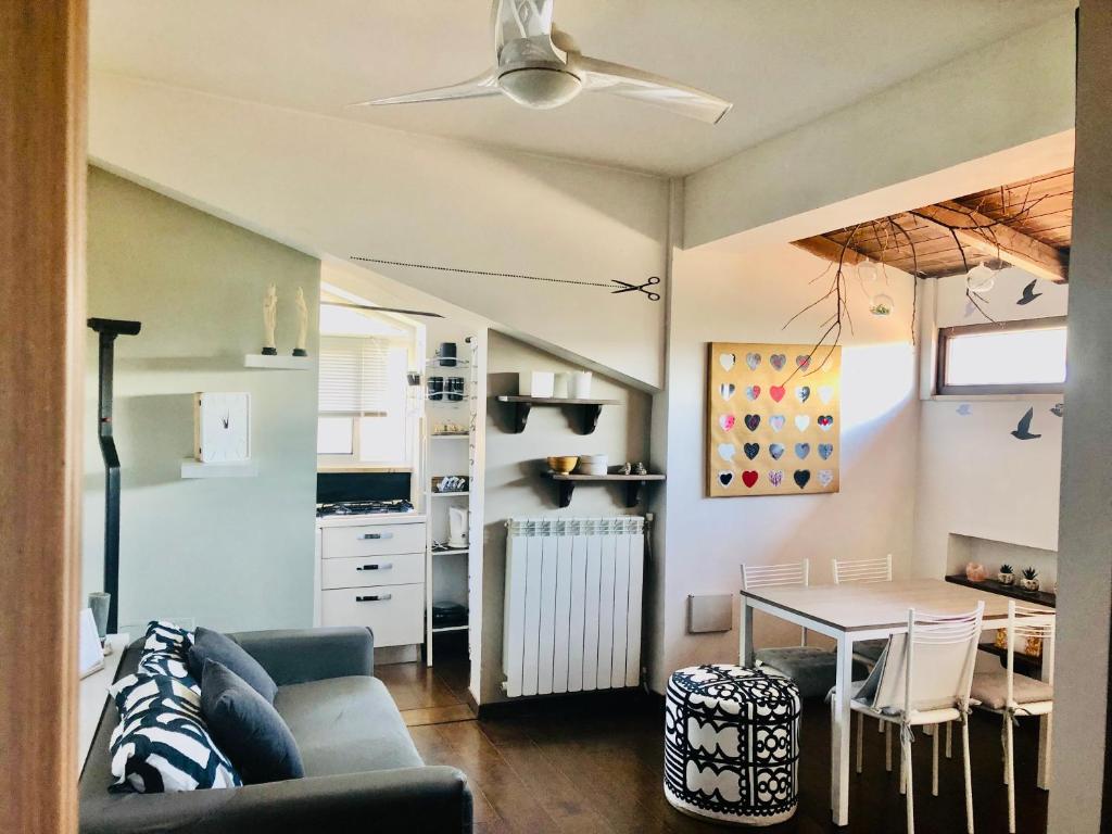a living room with a couch and a table at Carolina’S Nest in Casal Palocco