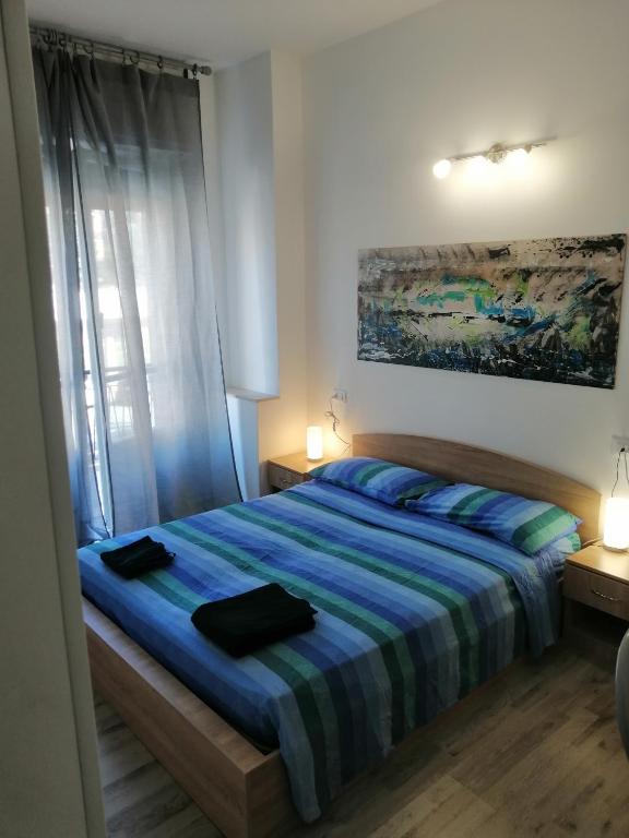 Posteľ alebo postele v izbe v ubytovaní Albergo blue fish