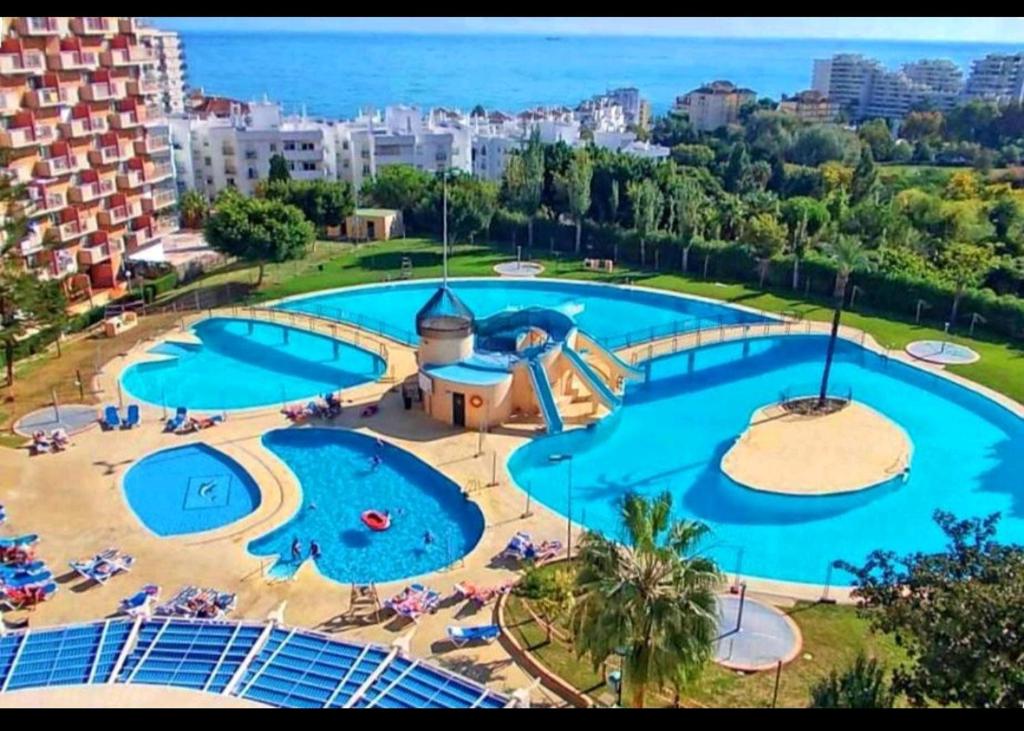 an overhead view of a large swimming pool at Benaldream in Benalmádena