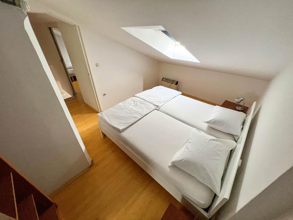 Postel nebo postele na pokoji v ubytování Apartments Arena