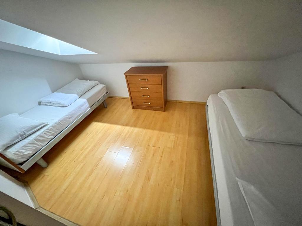 Postel nebo postele na pokoji v ubytování Apartments Arena