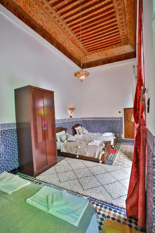 Postel nebo postele na pokoji v ubytování Riad Dar Jeanne