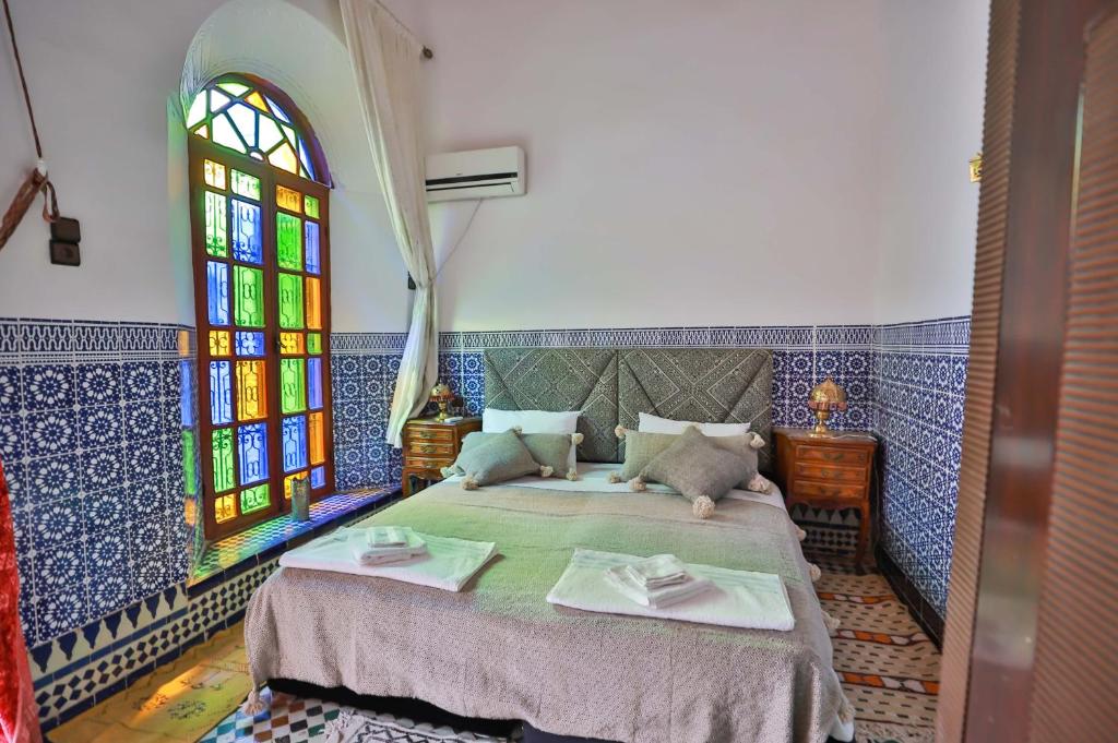 Postel nebo postele na pokoji v ubytování Riad Dar Jeanne