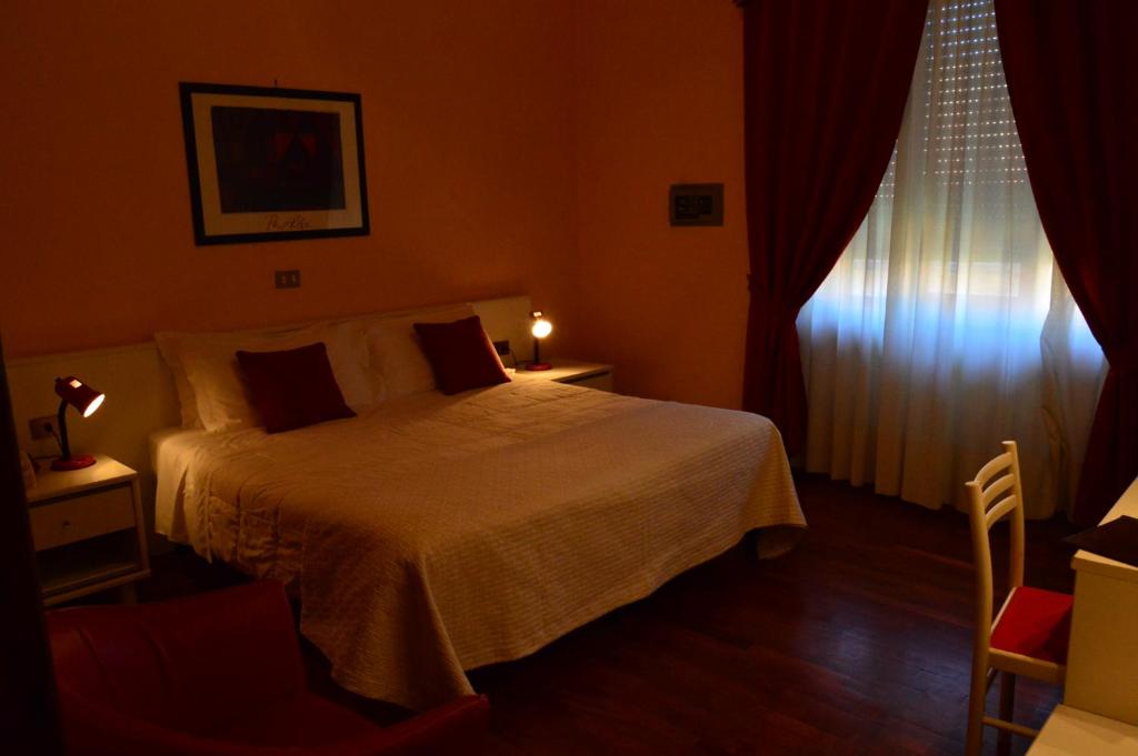Postel nebo postele na pokoji v ubytování Hotel Altavilla