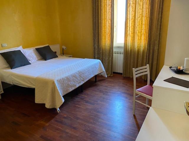 Postel nebo postele na pokoji v ubytování Hotel Altavilla
