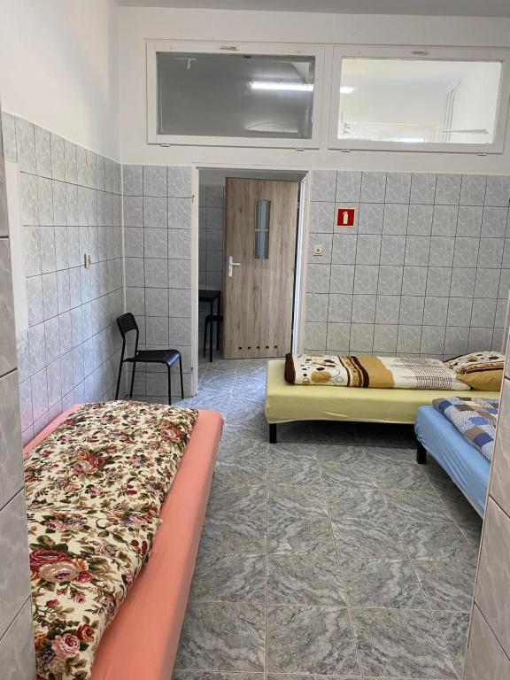 a bedroom with two beds in a room at Pokoje Fregata Świnoujście in Świnoujście