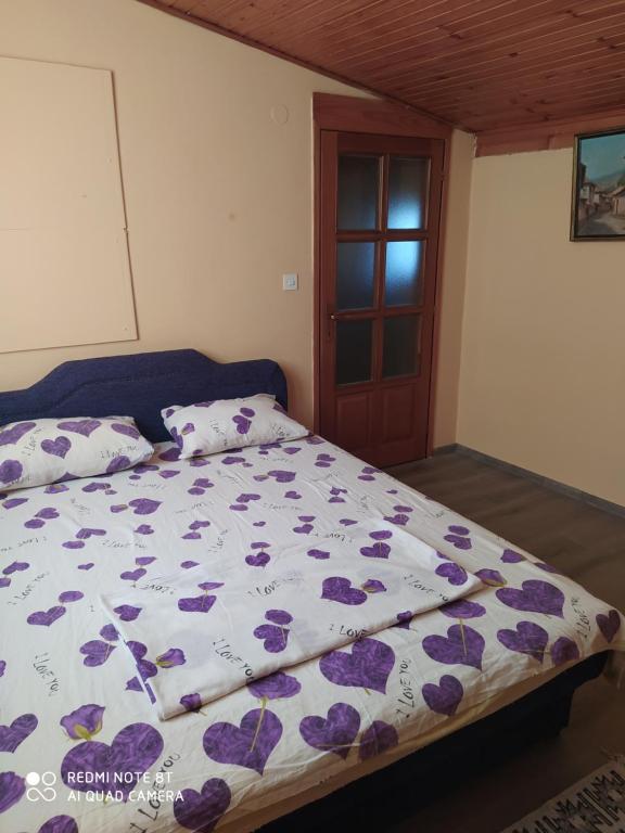 Postel nebo postele na pokoji v ubytování Apartman Mickey