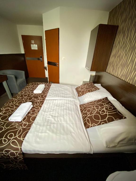 Postel nebo postele na pokoji v ubytování Penzión DOMES