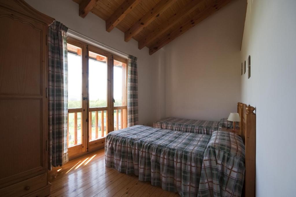 Postel nebo postele na pokoji v ubytování Mas Meya