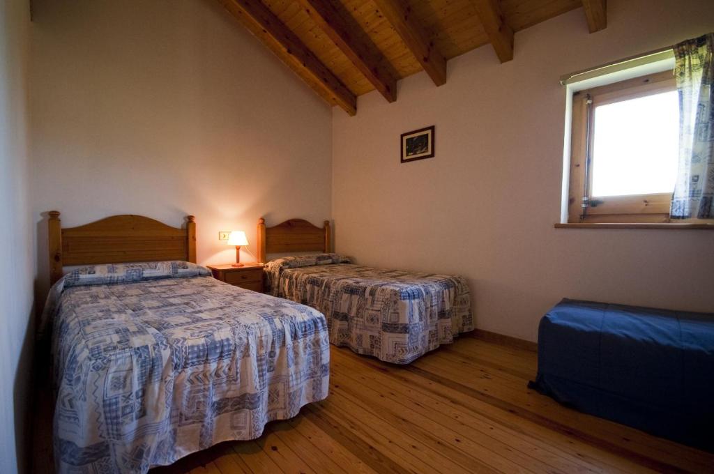 Postel nebo postele na pokoji v ubytování Mas Meya